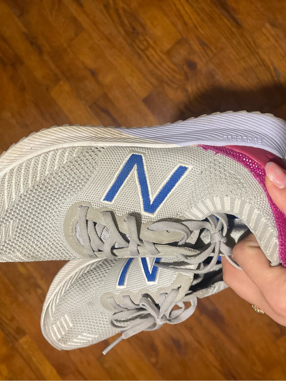 New Balance womens Gray Sneakers with Blue Logo and Pink Heel